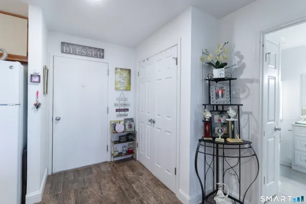 a view of a hallway with workspace and entryway