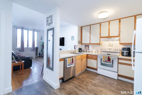 a kitchen with stainless steel appliances a stove sink and refrigerator