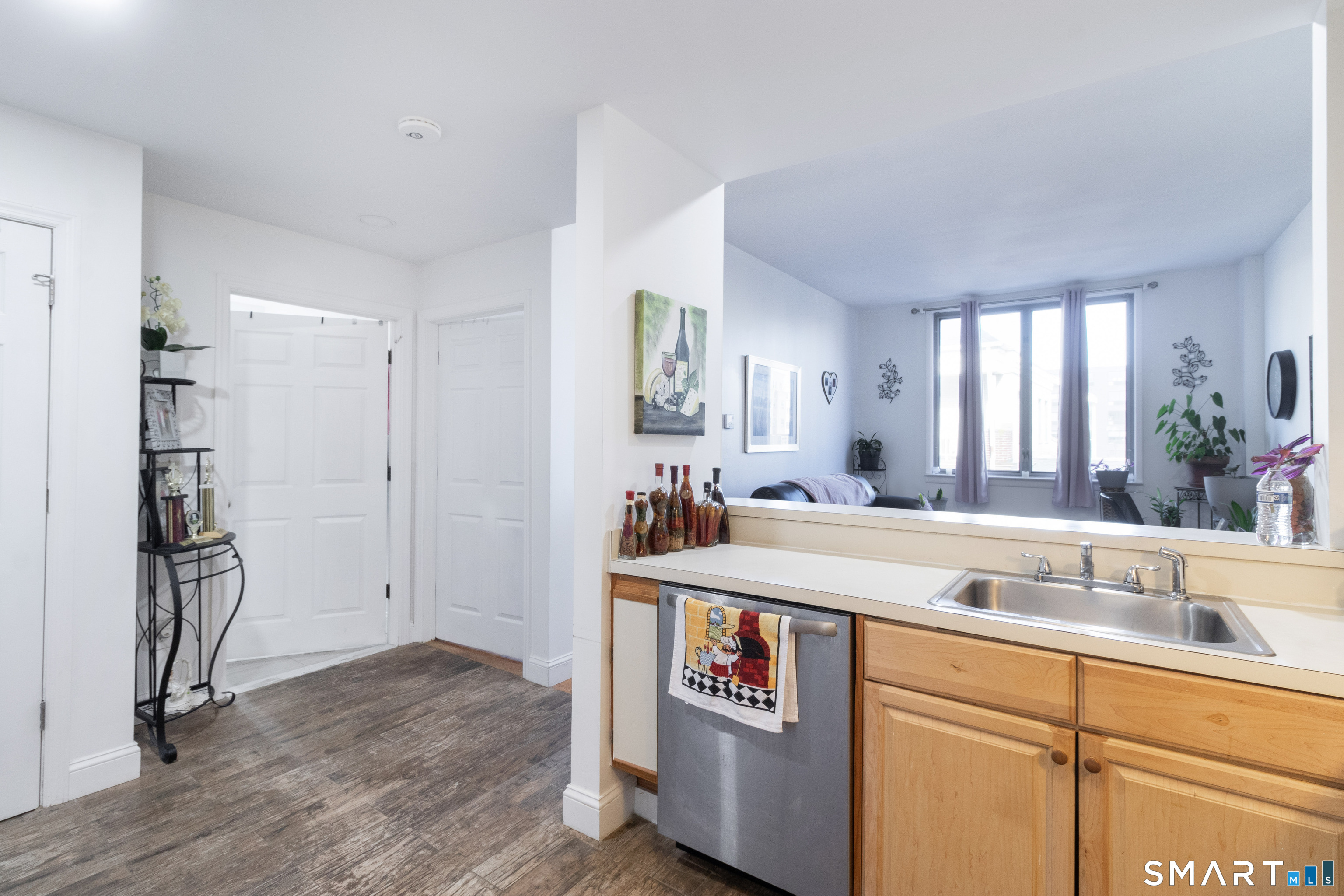 49 Day Street, Unit 209 Norwalk, CT 06854 - Photo 5 of 20 a view of a kitchen with a sink and refrigerator
