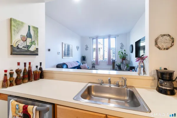 a kitchen with a sink and a refrigerator