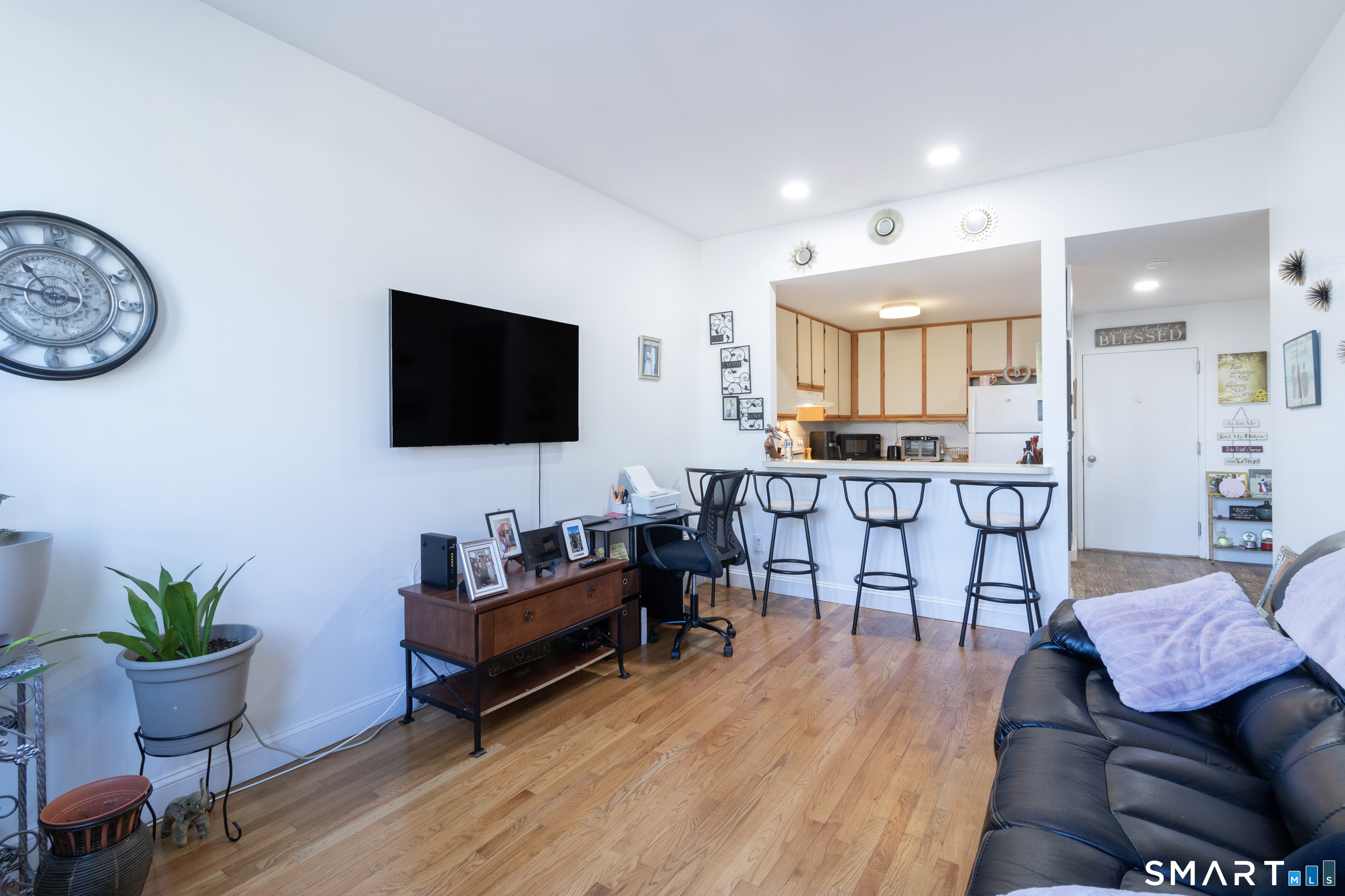 49 Day Street, Unit 209 Norwalk, CT 06854 - Photo 10 of 20 a living room with furniture and a flat screen tv