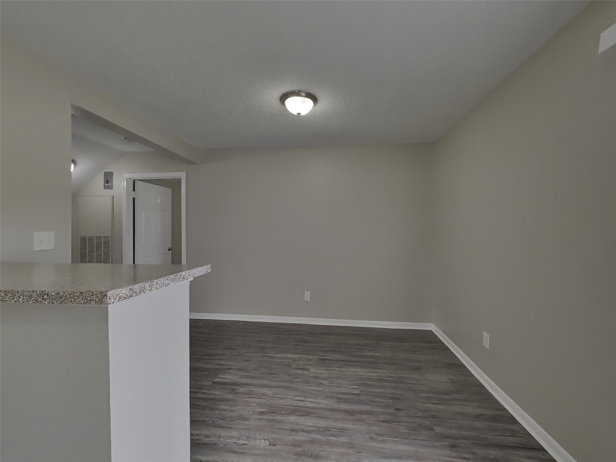 3210 Kelling Street Houston, TX 77045 - Photo 3 of 16 a view of a hallway with wooden floor