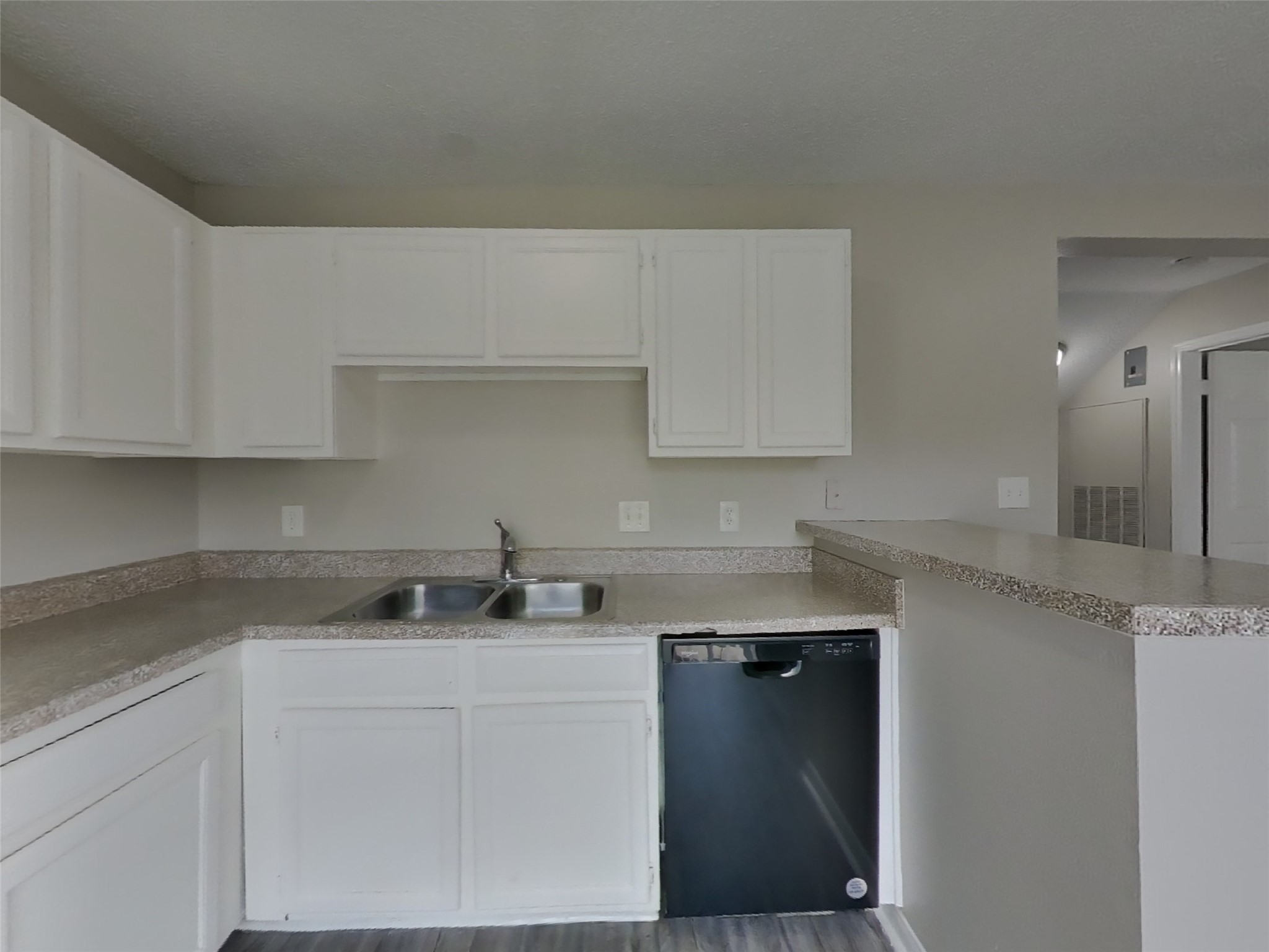 3210 Kelling Street Houston, TX 77045 - Photo 5 of 16 a kitchen with a sink and cabinets