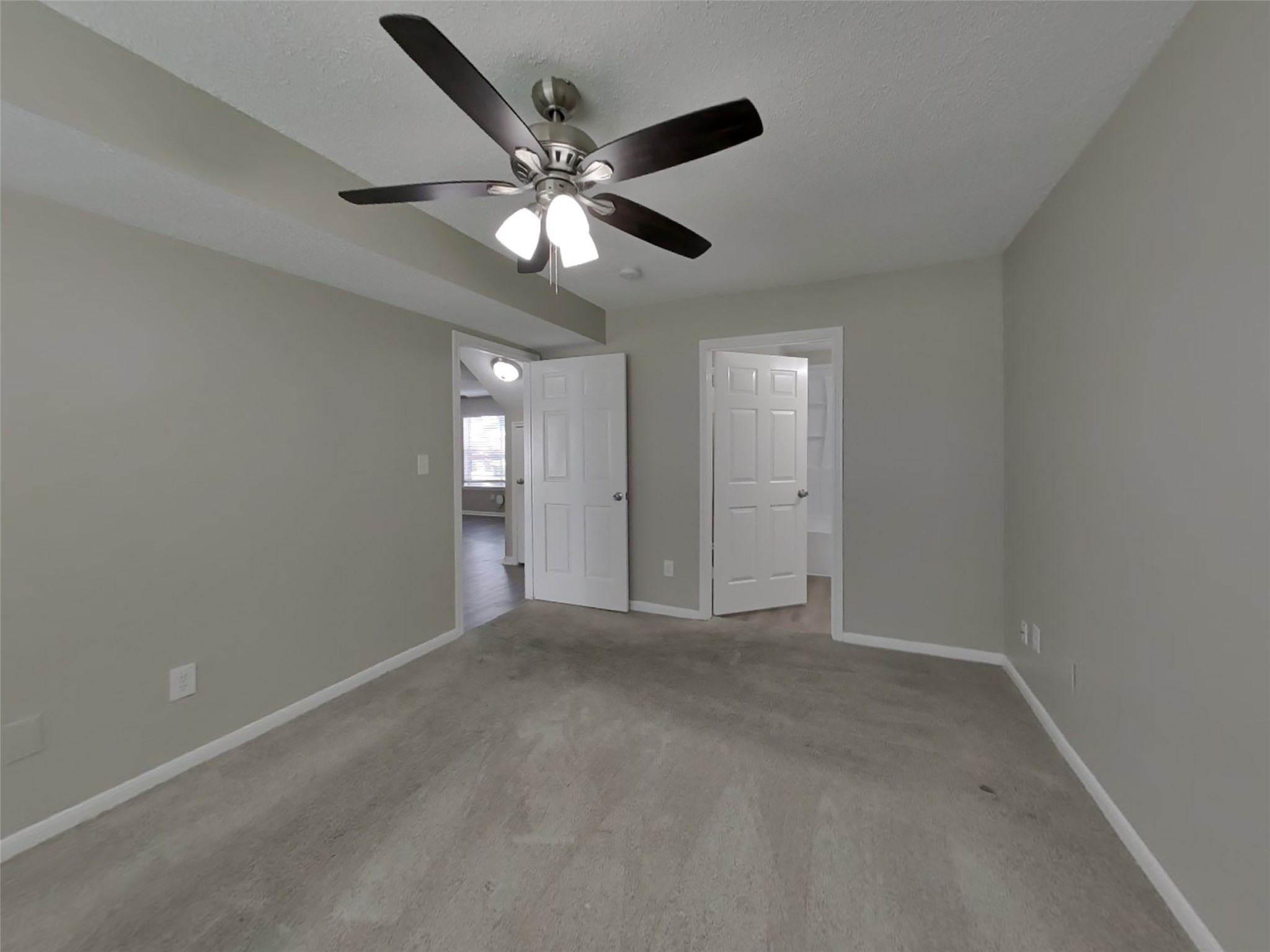 3210 Kelling Street Houston, TX 77045 - Photo 7 of 16 a view of an empty room with a chandelier fan