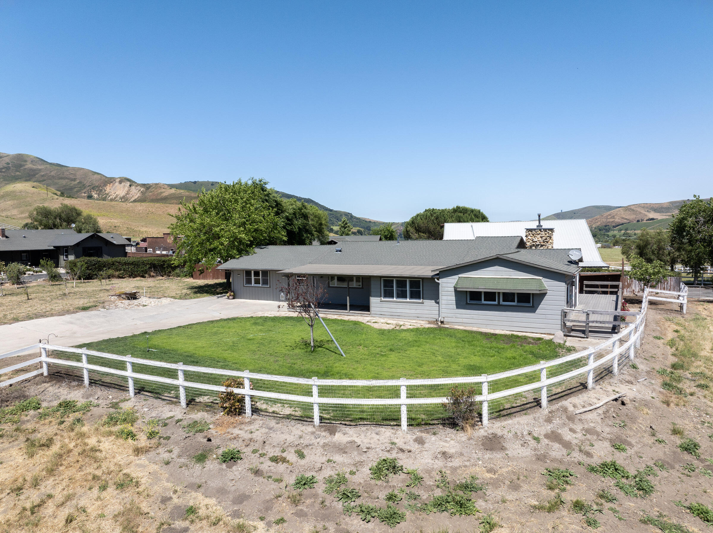 6500 Santa Rosa Road Buellton, CA 93427 - Photo 81 of 96 a view of a white house with a big yard and large trees