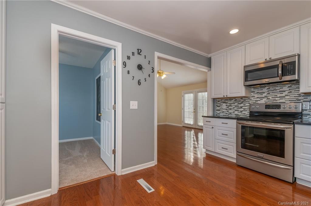 215 Orchard Grove Road, Unit 22 Campobello, SC 29322 - Photo 14 of 35 a kitchen with stainless steel appliances granite countertop a stove and a refrigerator
