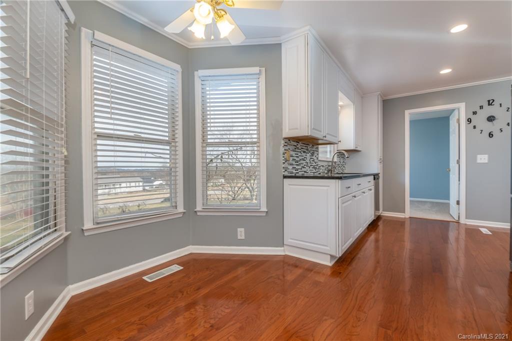 215 Orchard Grove Road, Unit 22 Campobello, SC 29322 - Photo 15 of 35 a view of a kitchen with an empty room and window