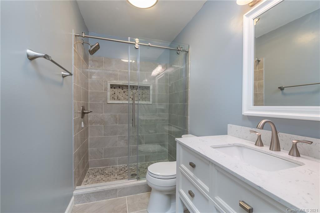215 Orchard Grove Road, Unit 22 Campobello, SC 29322 - Photo 26 of 35 a bathroom with a sink toilet and shower