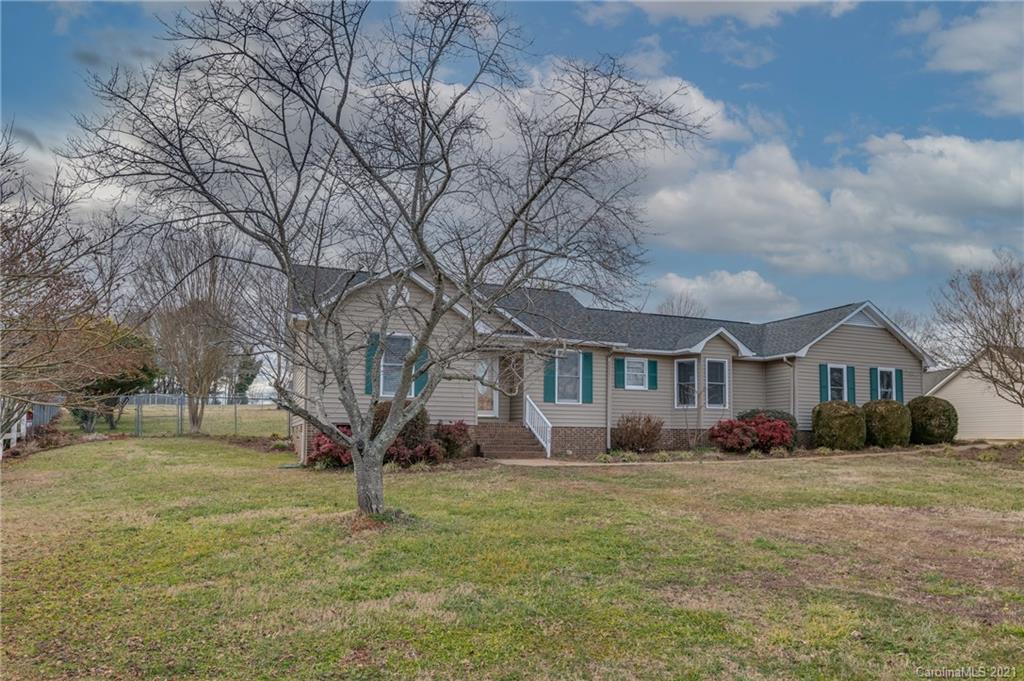 215 Orchard Grove Road, Unit 22 Campobello, SC 29322 - Photo 4 of 35 a front view of house with yard and trees around