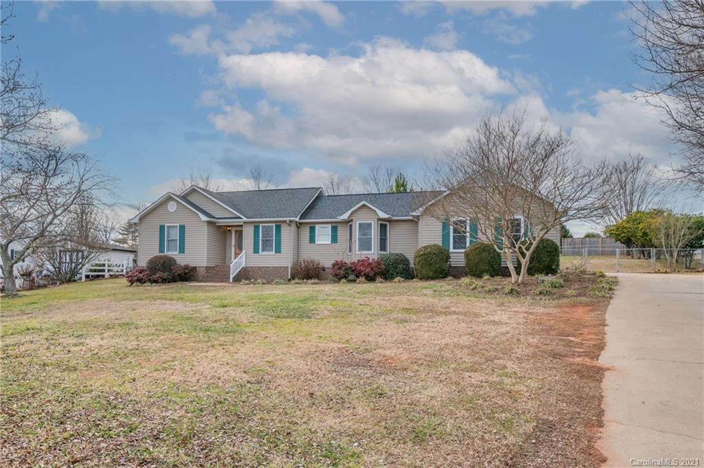 215 Orchard Grove Road, Unit 22 Campobello, SC 29322 - Photo 5 of 35 a front view of a house with a yard