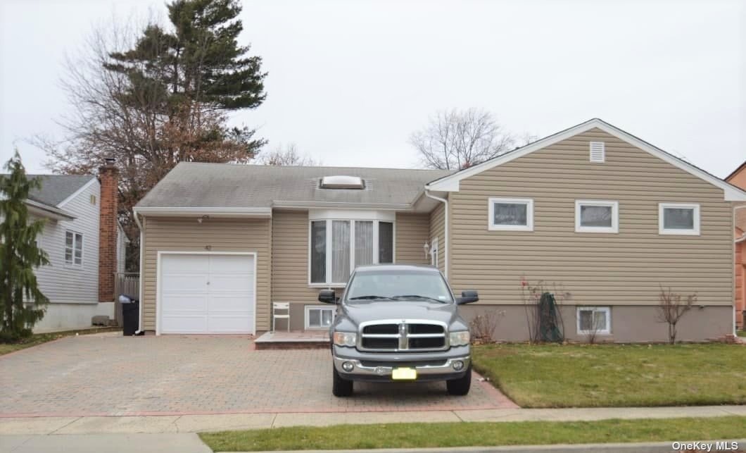 42 Cloverfield Road South Valley Stream, NY 11581 - Photo 1 of 1 a car parked in front of white house