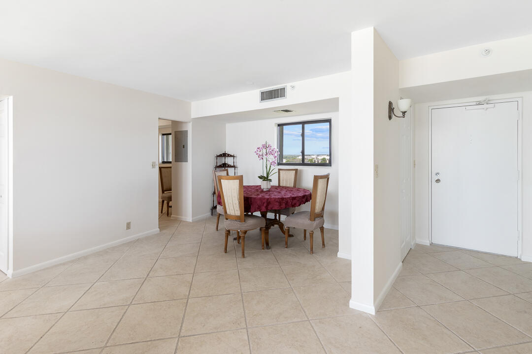 400 Ocean Trail Way, Unit 1108 Jupiter, FL 33477 - Photo 16 of 41 a view of a dining room with furniture and a window