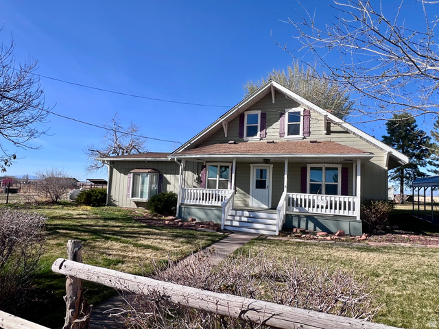 479 East 100 N Road Meadow, UT 84644 - Photo 47 of 59 Bungalow with a front yard, a porch, and a shingled roof
