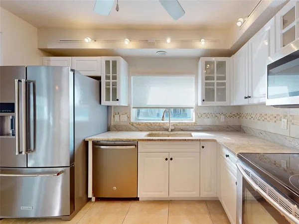 a view of a kitchen with granite countertop cabinets and a sink