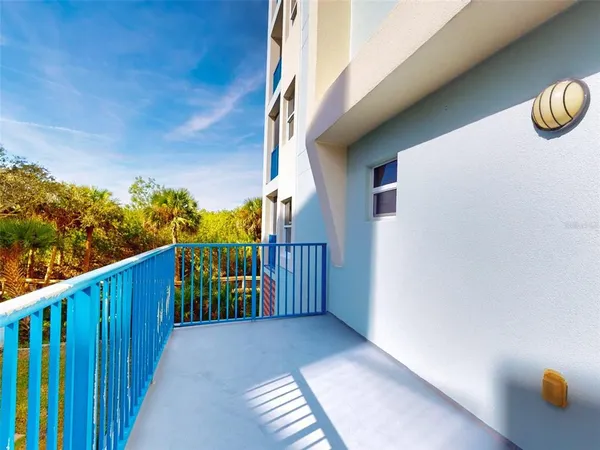 a balcony with wooden floor
