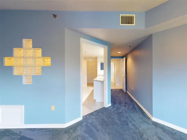 a bathroom with a granite countertop sink mirror and shower