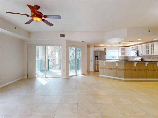 a view of a kitchen with furniture and windows