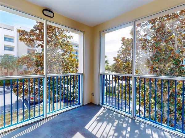 a view of a balcony with wooden floor