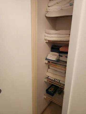 a view of kitchen with furniture and refrigerator