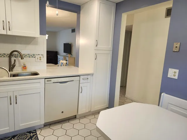 a bedroom with a sink and a mirror