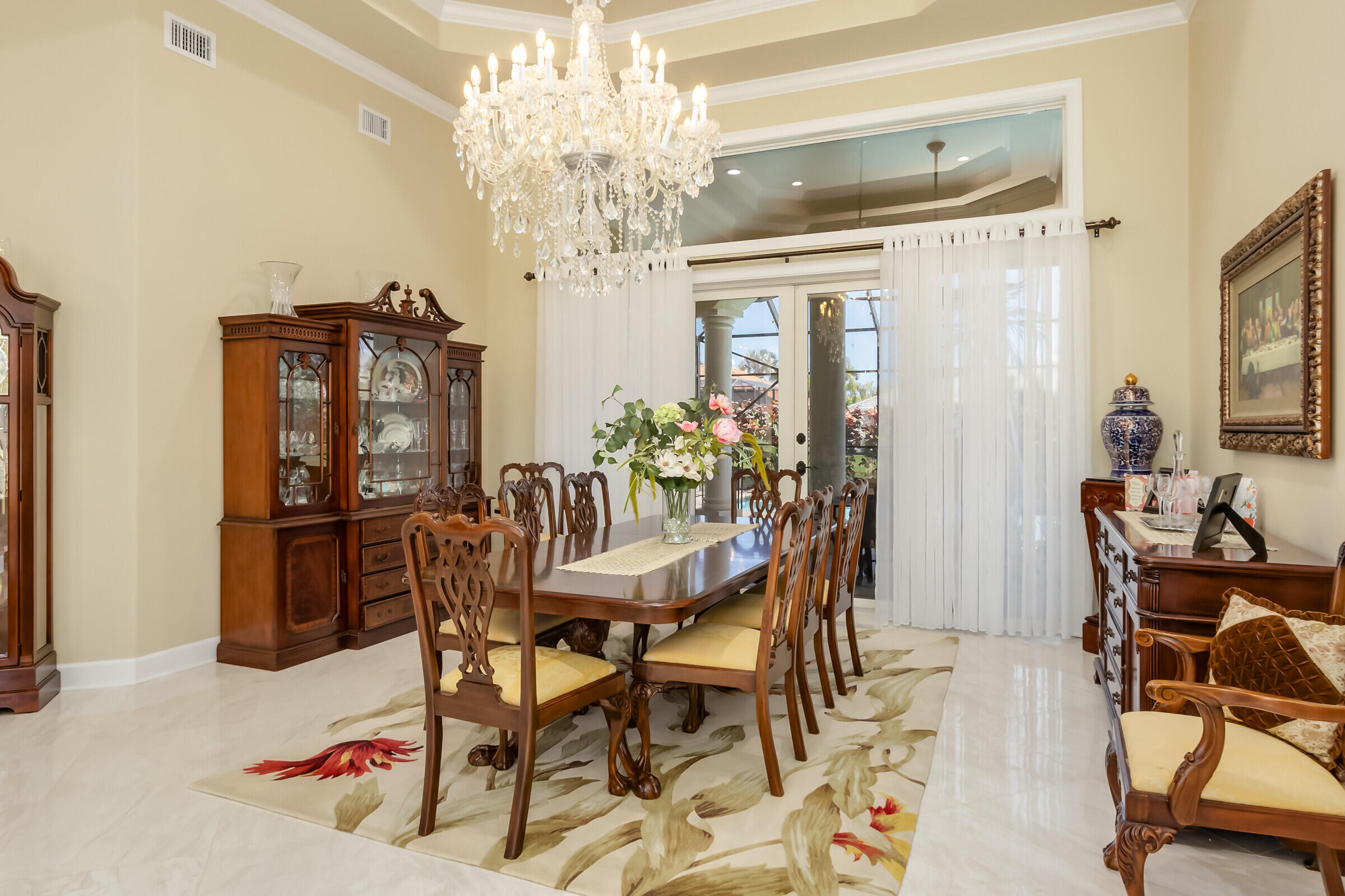 335 Normandy Drive Indialantic, FL 32903 - Photo 16 of 55 a view of a dining room with furniture and chandelier