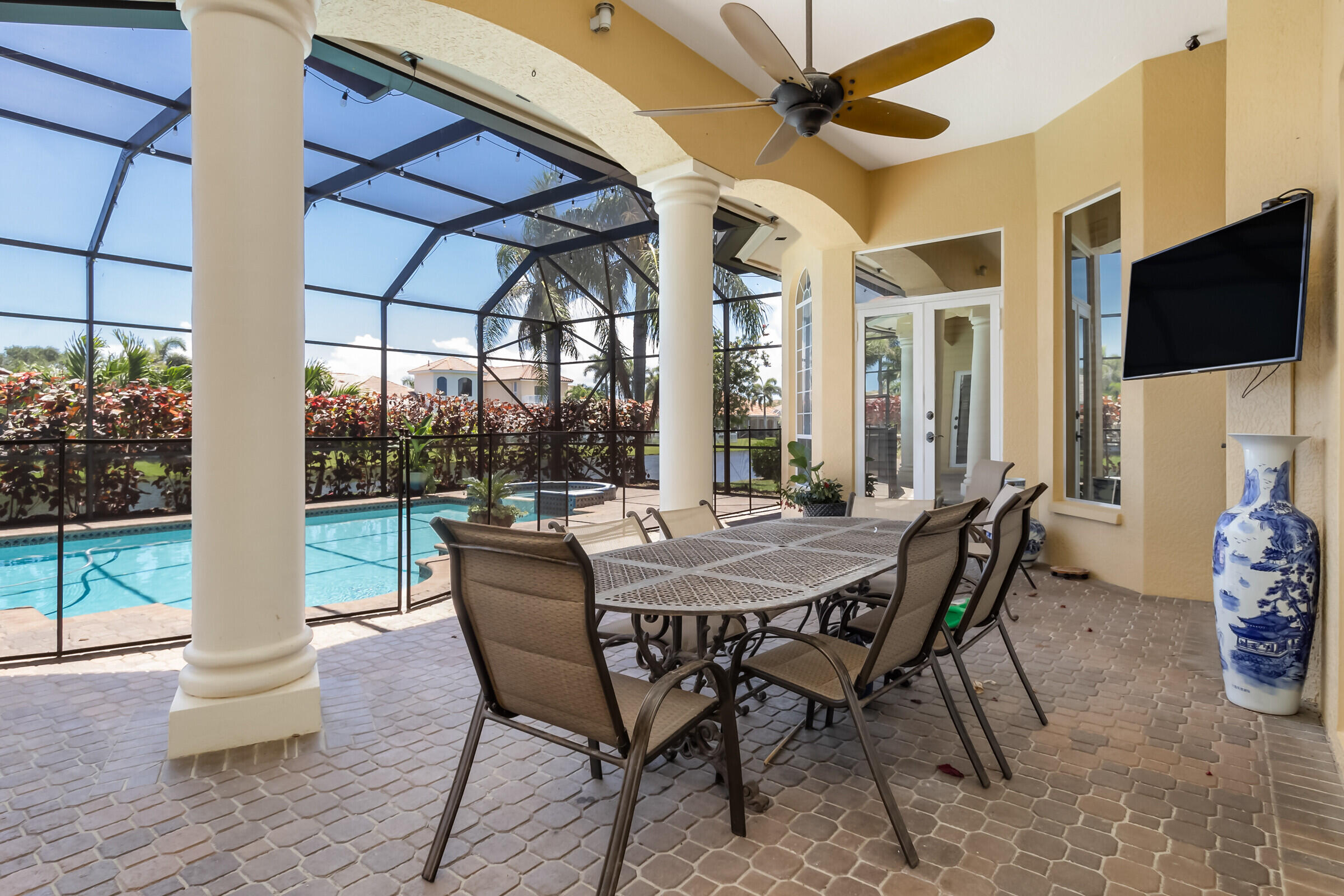 335 Normandy Drive Indialantic, FL 32903 - Photo 22 of 55 a dining room with furniture a chandelier and wooden floor