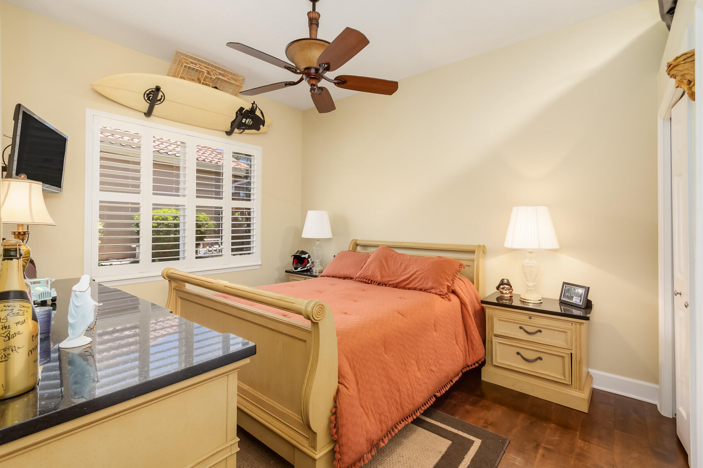 335 Normandy Drive Indialantic, FL 32903 - Photo 25 of 55 a bedroom with a bed and a tv on the dresser