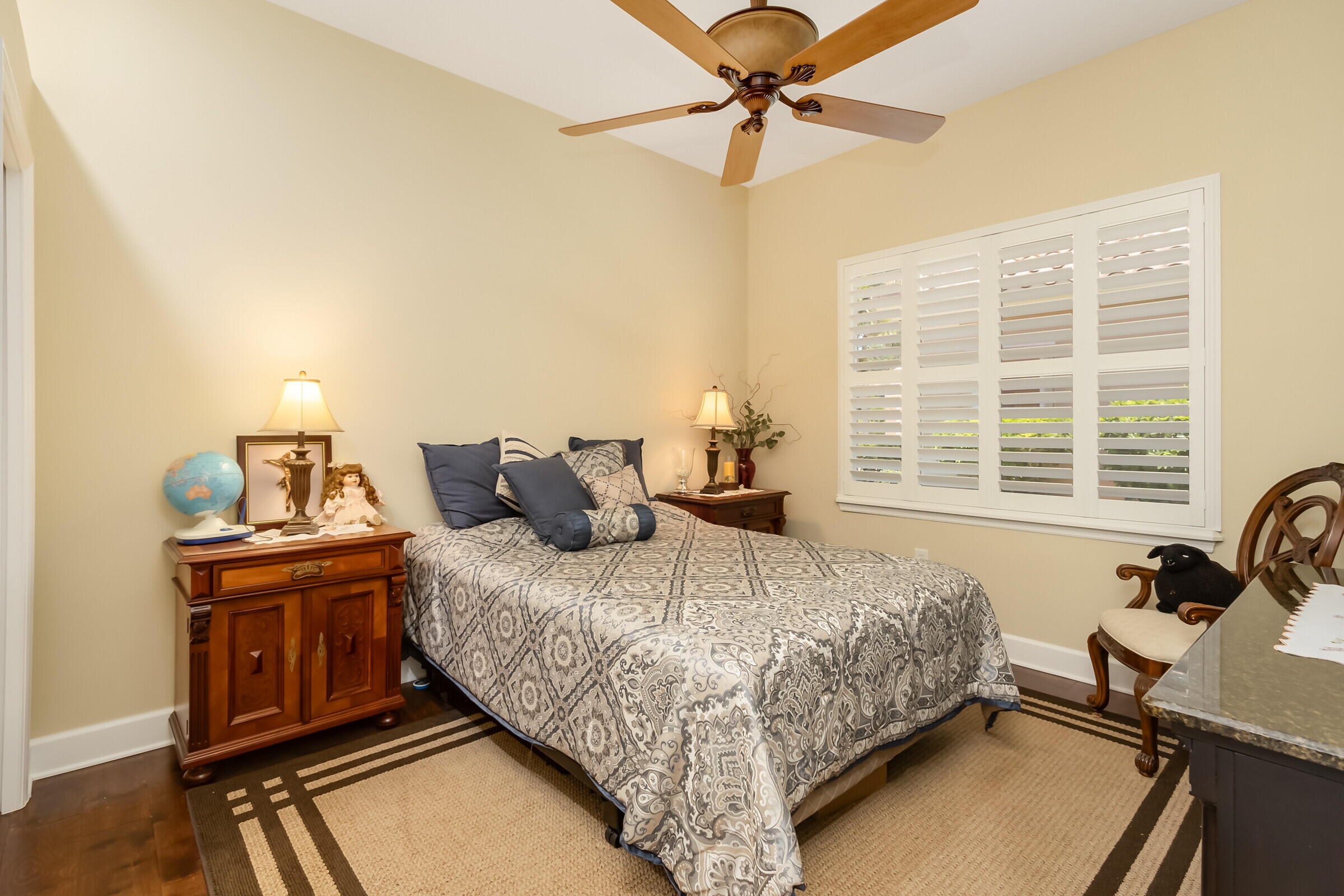 335 Normandy Drive Indialantic, FL 32903 - Photo 27 of 55 a bedroom with a bed and a chandelier