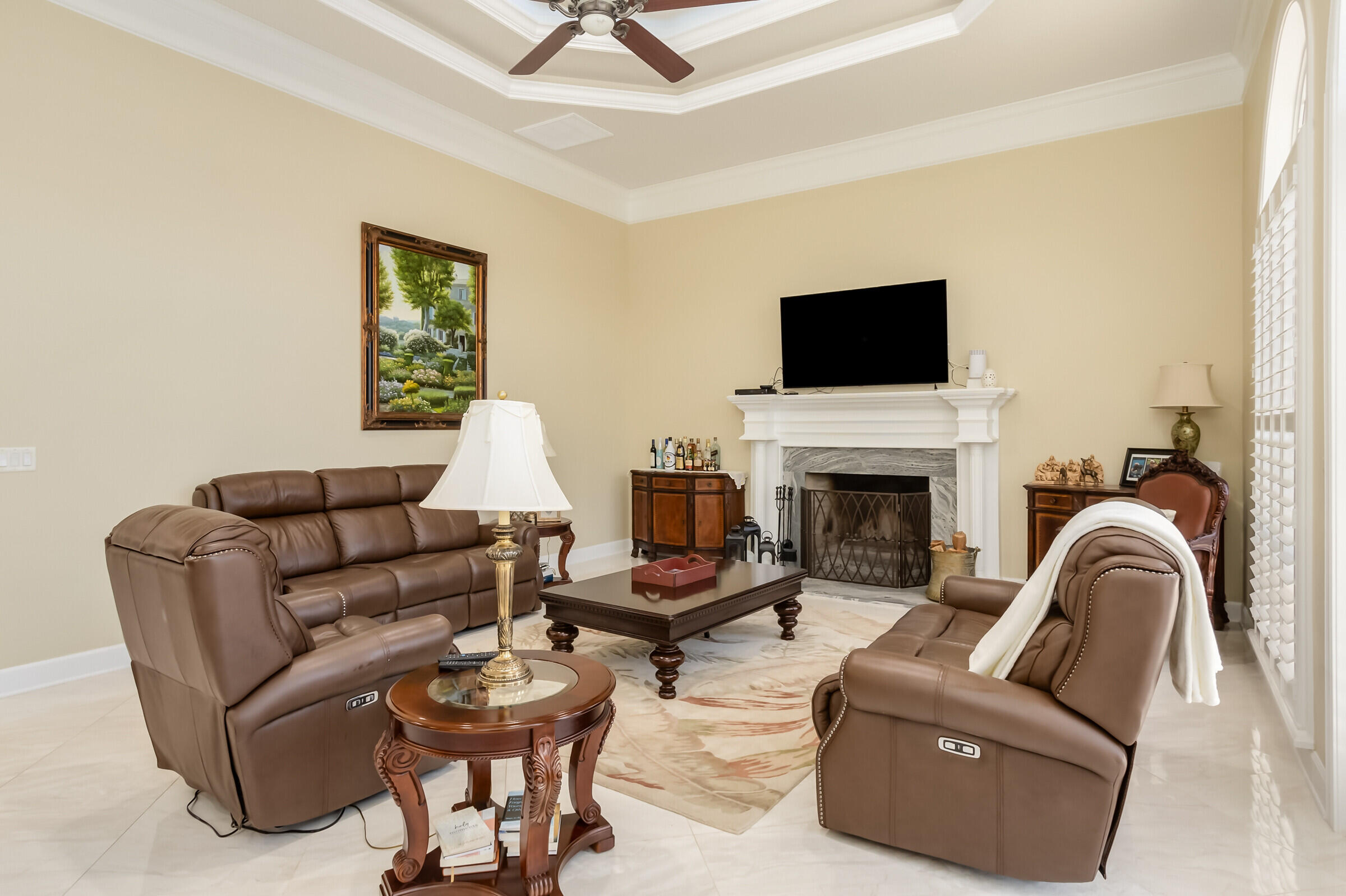 335 Normandy Drive Indialantic, FL 32903 - Photo 37 of 55 a living room with furniture a flat screen tv and a fireplace