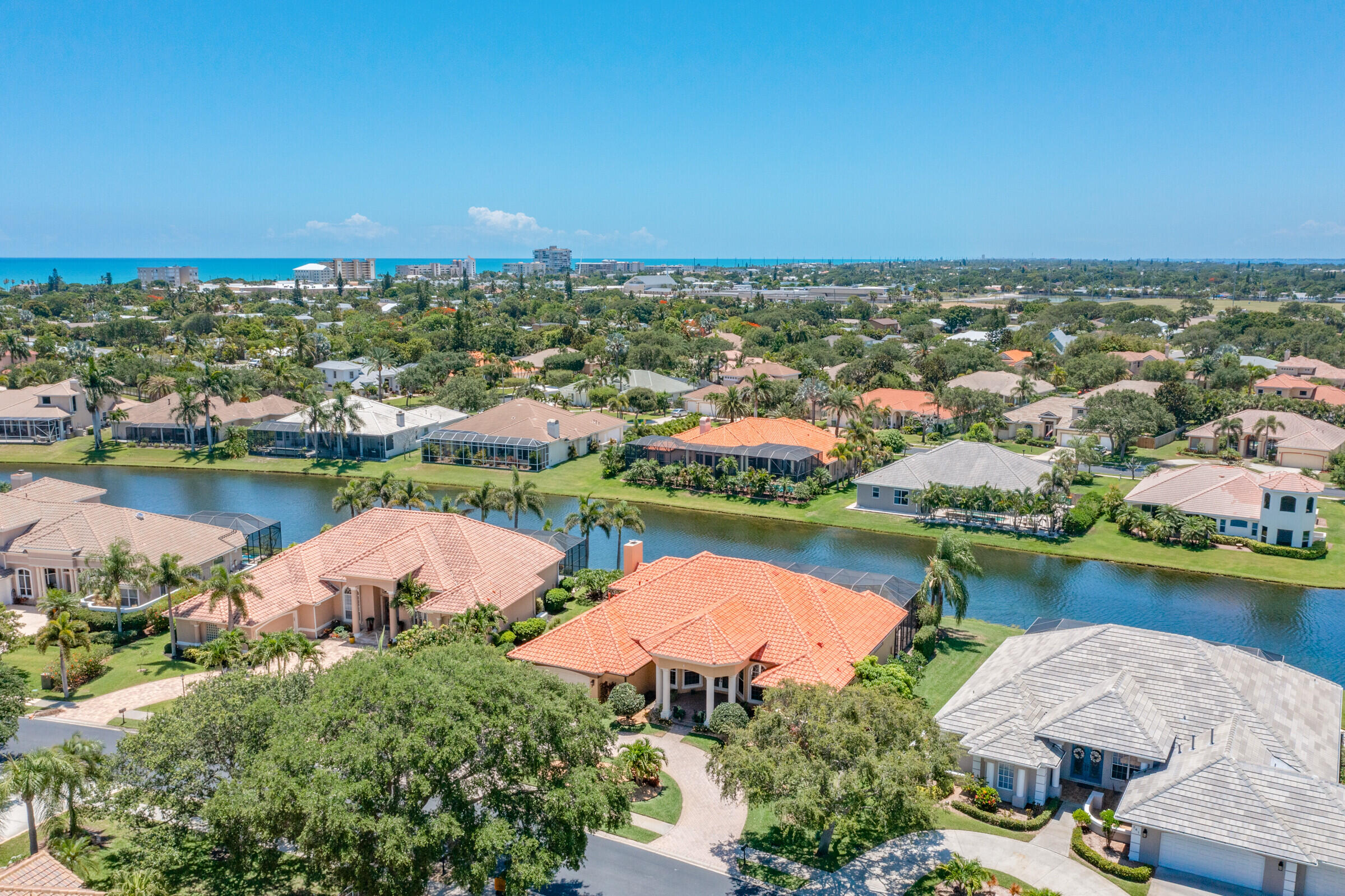 335 Normandy Drive Indialantic, FL 32903 - Photo 51 of 55 an aerial view of residential houses with outdoor space and lake view
