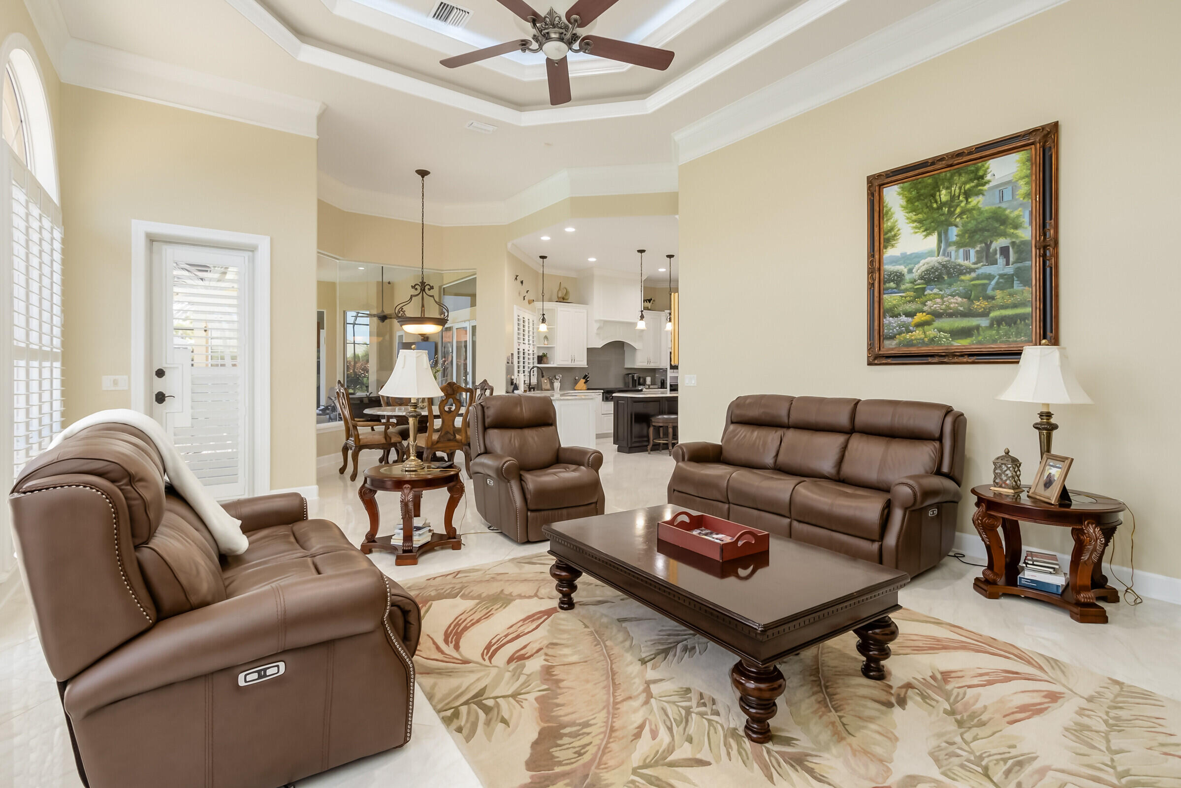 335 Normandy Drive Indialantic, FL 32903 - Photo 8 of 55 a living room with furniture ceiling fan and a rug