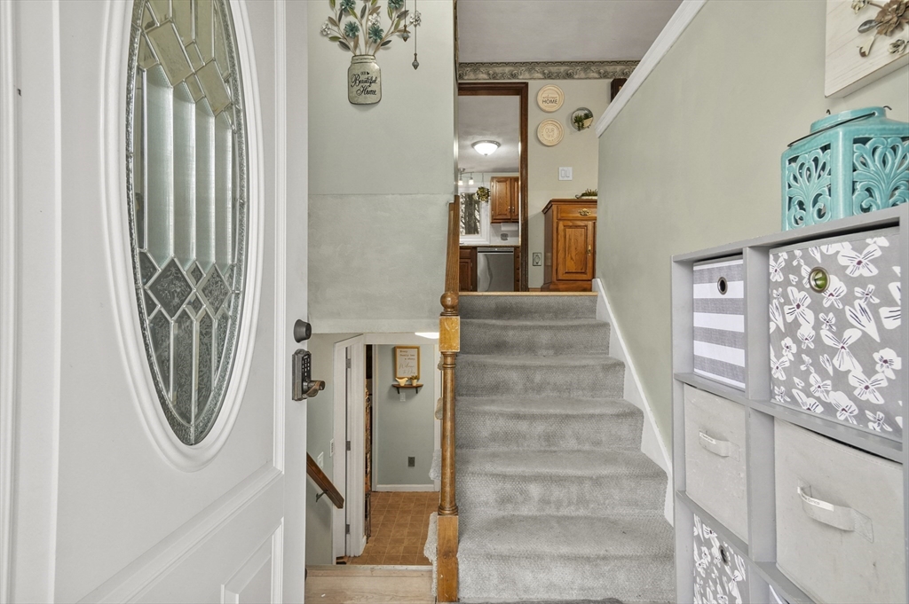 33 Frost Road Derry, NH 03038 - Photo 2 of 30 a view of a hallway with wooden floor and entryway