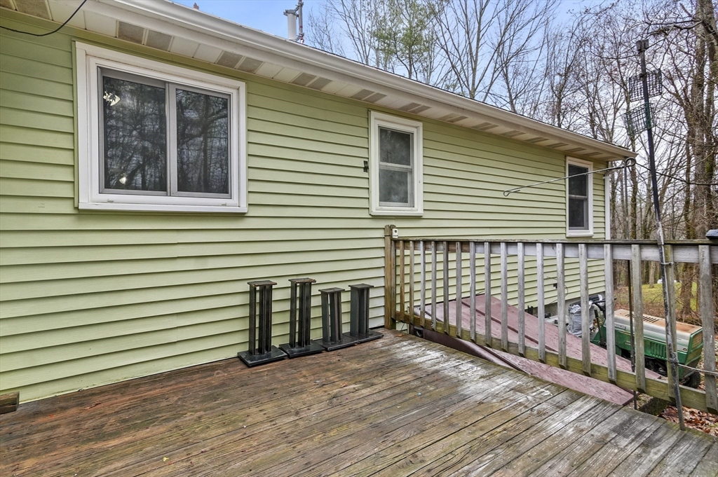 33 Frost Road Derry, NH 03038 - Photo 24 of 30 a view of a house with backyard and wooden floor