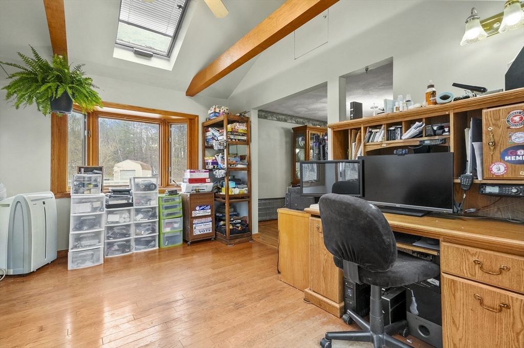 33 Frost Road Derry, NH 03038 - Photo 9 of 30 a view of a workspace with furniture and a window