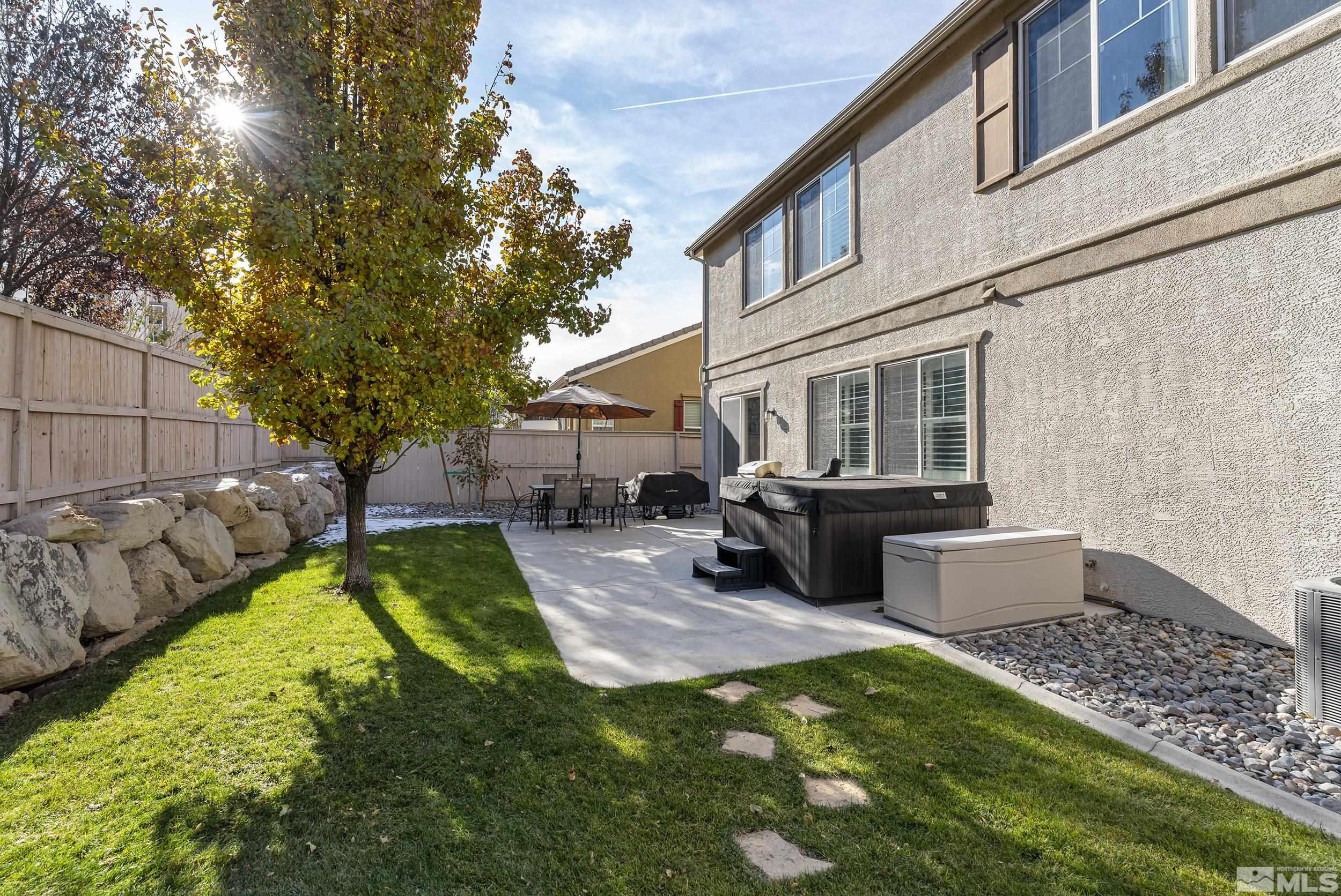10806 Oakhaven Drive Reno, NV 89521 - Photo 23 of 27 a view of a house with a yard