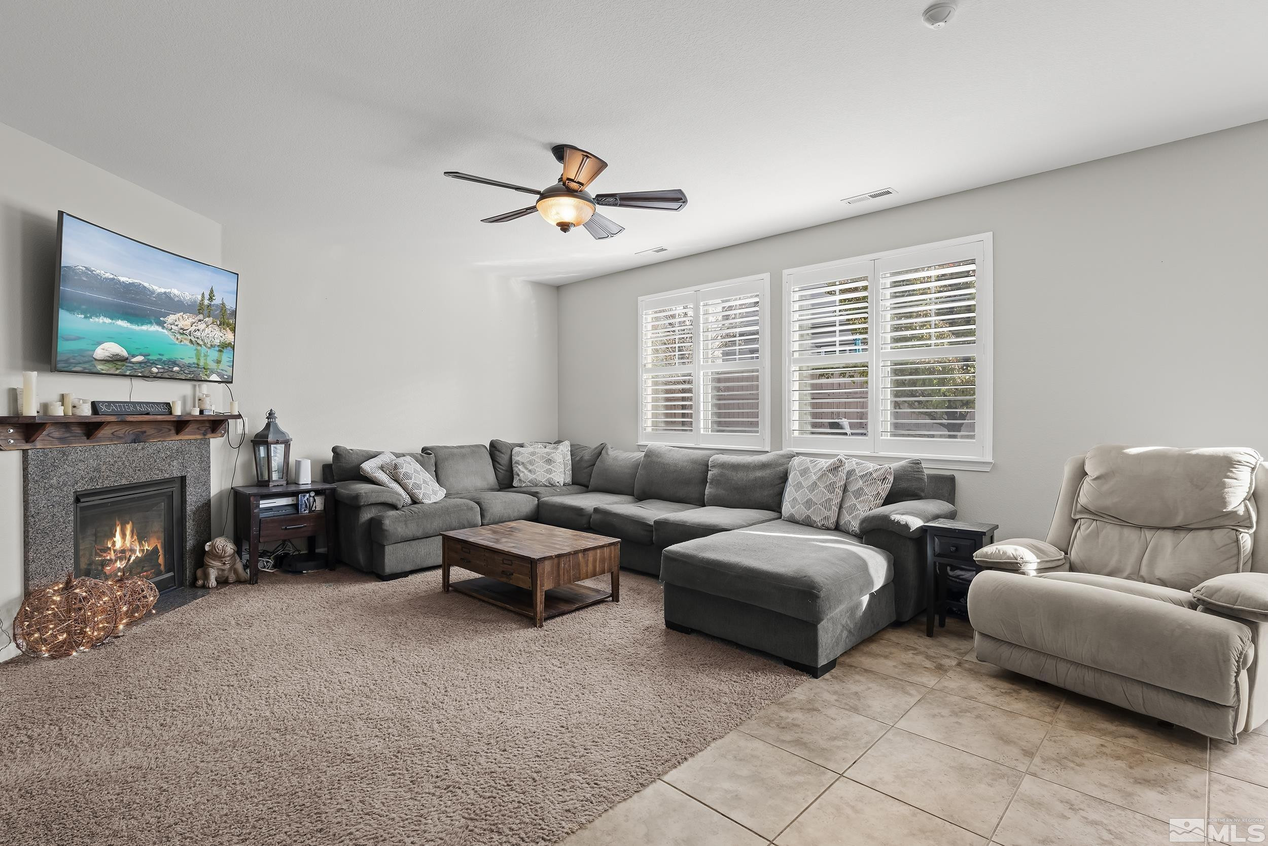 10806 Oakhaven Drive Reno, NV 89521 - Photo 5 of 27 a living room with furniture and a fireplace