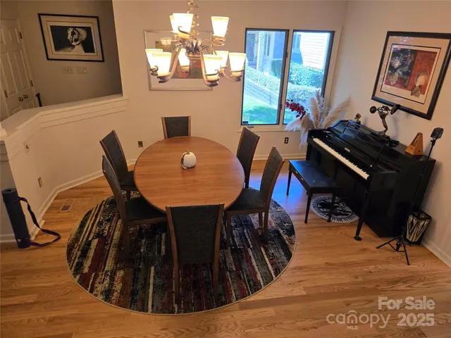 a living room with furniture and a mirror