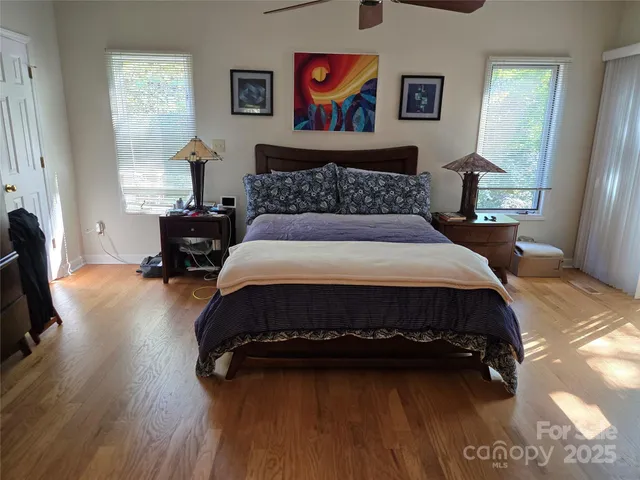 a bedroom with bed and window