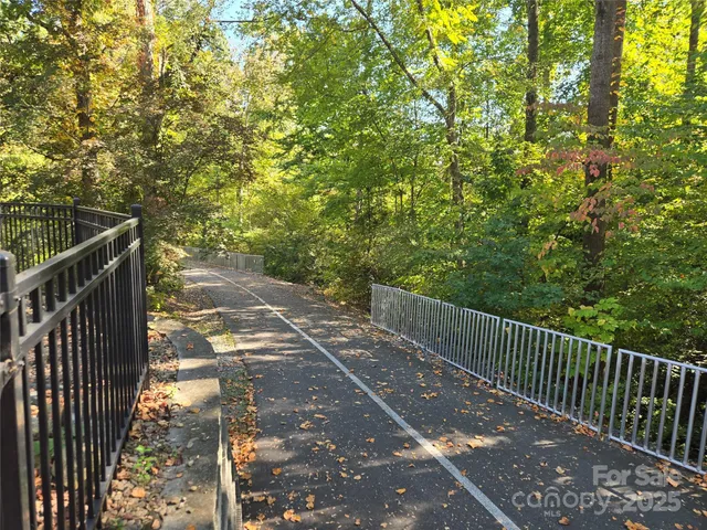 a view of a pathway with a street
