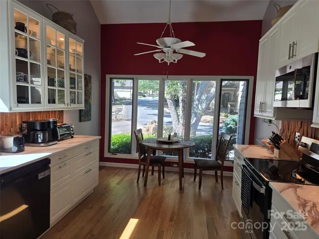 a view of a dining room with furniture window and wooden floor