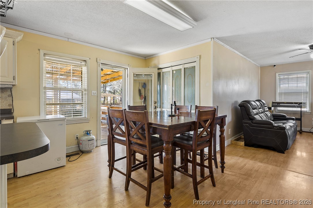1408 Seabrook School Road Fayetteville, NC 28312 - Photo 16 of 44 a view of a dining room with furniture