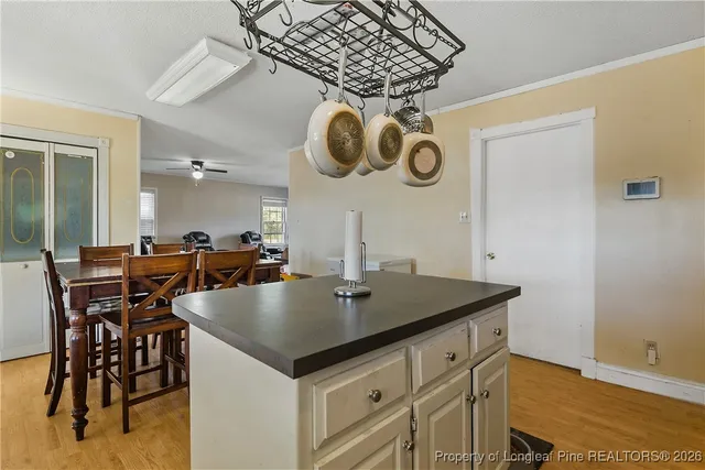 an open kitchen with a table and chairs in it