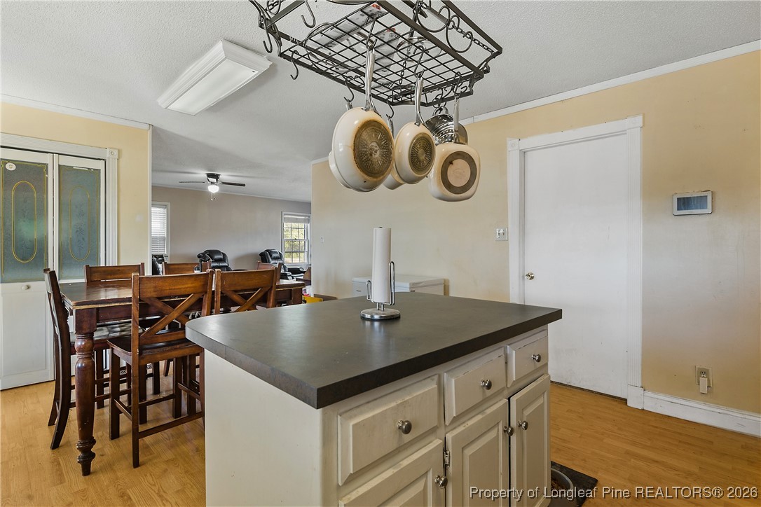 1408 Seabrook School Road Fayetteville, NC 28312 - Photo 24 of 44 an open kitchen with a table and chairs in it
