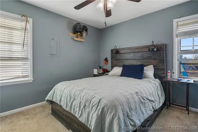 a bedroom with a bed and window