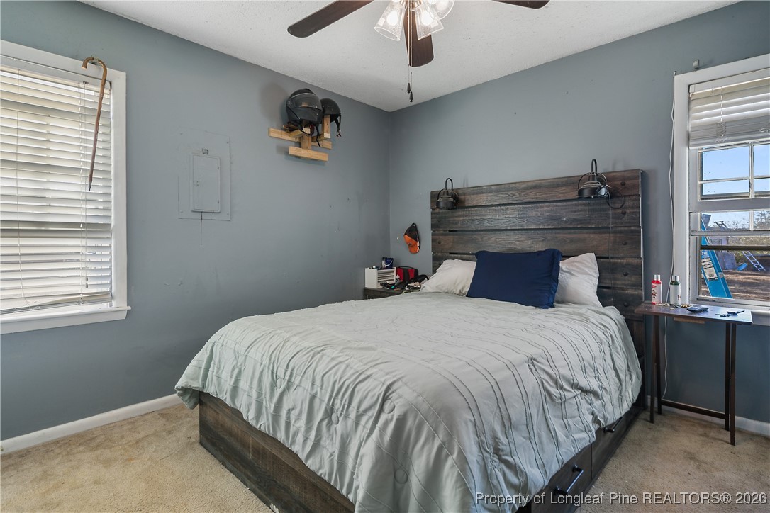 1408 Seabrook School Road Fayetteville, NC 28312 - Photo 25 of 44 a bedroom with a bed and window
