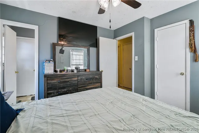 a room with a bed and a flat screen tv