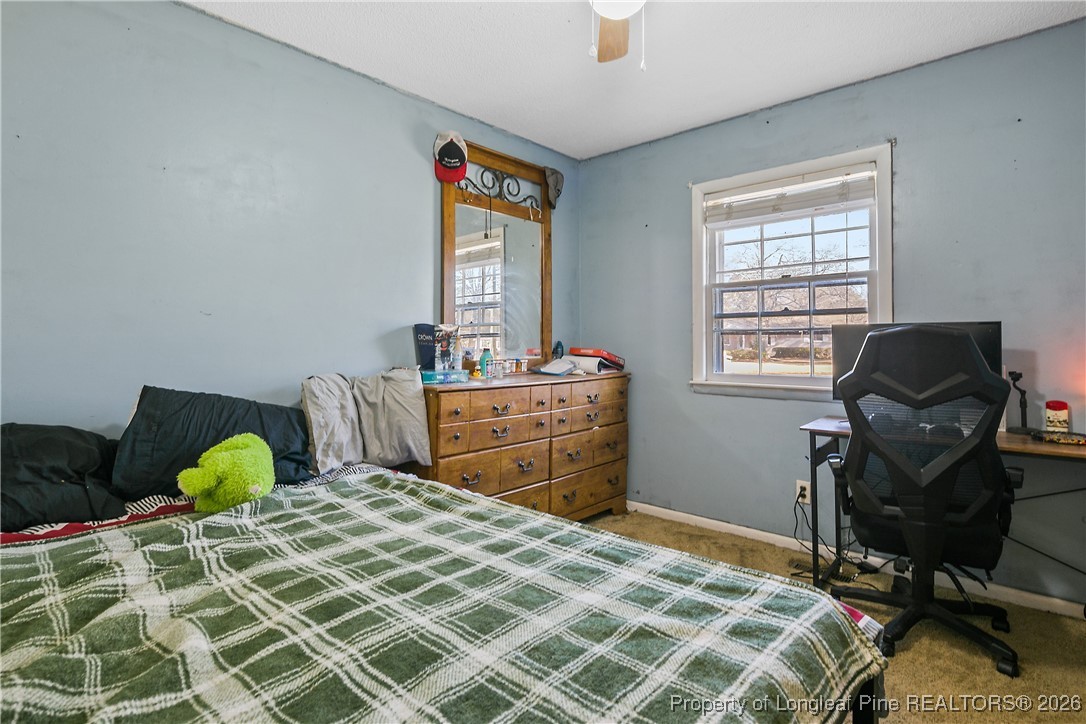 1408 Seabrook School Road Fayetteville, NC 28312 - Photo 31 of 44 a bedroom with a bed and a window