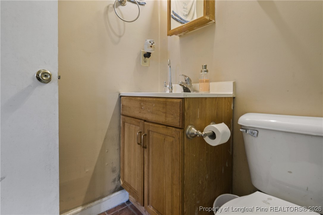 1408 Seabrook School Road Fayetteville, NC 28312 - Photo 35 of 44 a bathroom with a toilet and shower