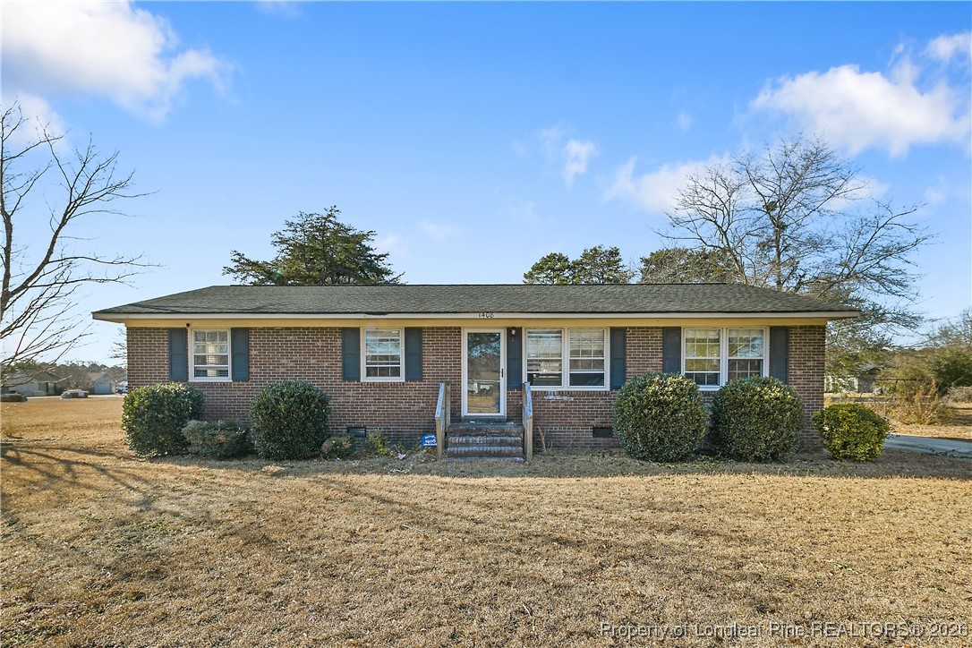 1408 Seabrook School Road Fayetteville, NC 28312 - Photo 4 of 44 front view of a house with a yard