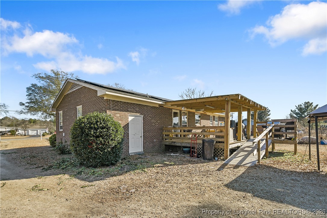 1408 Seabrook School Road Fayetteville, NC 28312 - Photo 43 of 44 a front view of a house with a yard